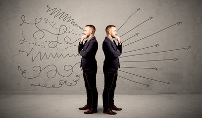 Young conflicted businessman choosing between two directions with arrows and scribbles around him