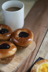 Bakery set of various breads, Cream bread, Blueberry liberty bun, Mini peach crumble and coffee.