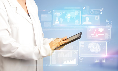 Female doctor holding tablet with blue background and informative graphs and charts 