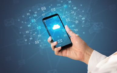 Female hand using smartphone with cloud, message and global concept
