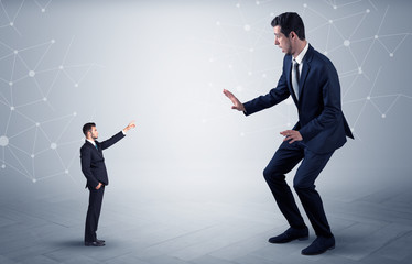 Small businessman aiming at a big businessman with connection and network concept
