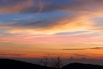 Colorful sky at sunset..Amazing twilight sky over mountain coastline of andaman sea .