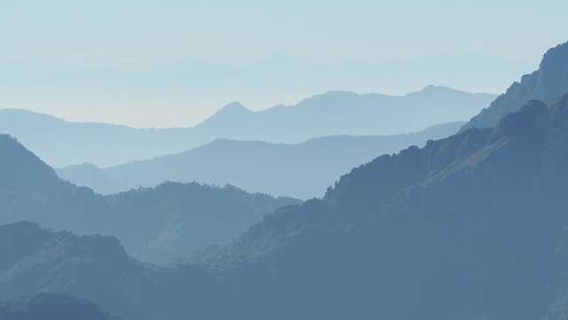 Landscape on hills and Alps mountains with humidity in the air and pollution. Panorama from Farno Mountain, Bergamo, Italy