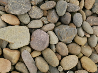 Fototapeta na wymiar pebbles on the beach,rock stone texture background