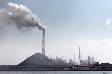 large pipes of metal production from which there is smoke