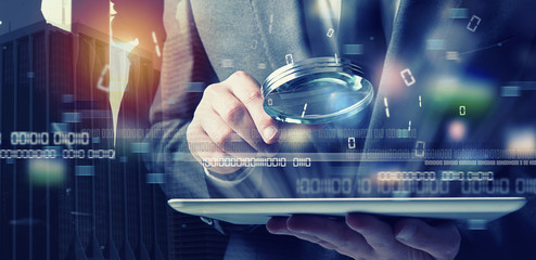 Businessman found a backdoor access on a tablet. Concept of internet security