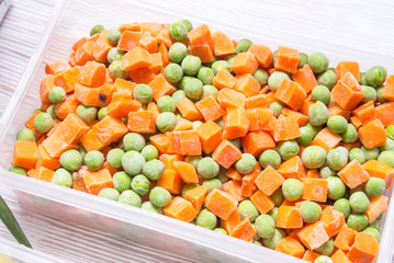 Plastic storage boxes with frozen vegetables