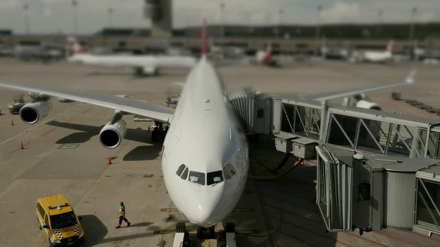 Timelapse of commercial airplane at airport terminal