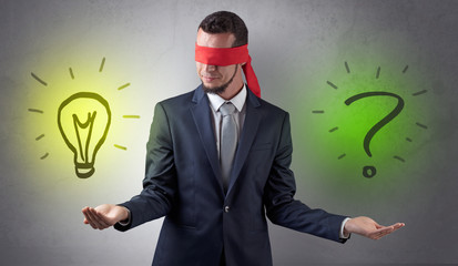 Covered eye businessman with bulb and question sign symbols around