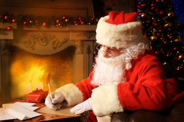 Portrait of Santa Claus answering Christmas letters.
