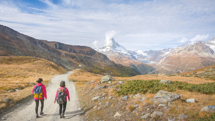 Hiking in the Swiss alps with the Matterhorn peak in the background, Switzerland