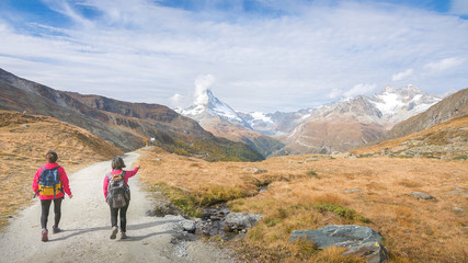 Hiking in the Swiss alps with the Matterhorn peak in the background, Switzerland
