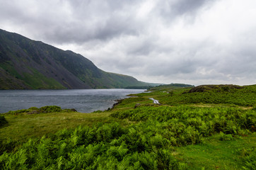 A road and the landscape surrounding the Wastwater Lake, including Whin Rigg and the Screes, in the English Lake District National Park, Cumbria
