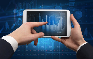 First person hand using tablet and checking financial report on cloud computing system
