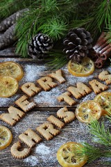 Cinnamon letter cookies with dried lemons for christmas 