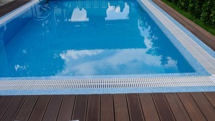 View of a empty swimming pool with blue wa