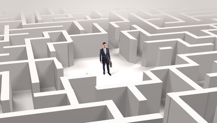 Young businessman standing in a middle of a 3D maze
