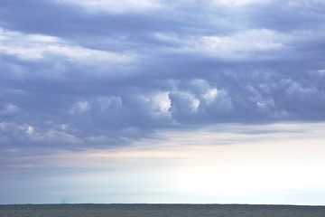 Naklejka na ściany i meble Dramatic, wind-swept clouds over the Chesapeake Bay.