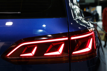 Detail on the rear light of a car. Car detail. Developed Car's rear brake light