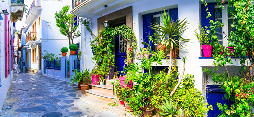 Traditional narrow streets with floral decoration in Greece. Skopelos island