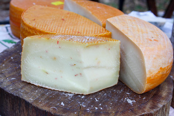 Beautiful cut cheese with orange crunchy covering and herbs inside