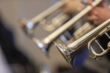 People playing the trumpet during rehearsal