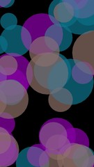 Multicolored translucent circles on a dark background. Vertical image orientation. 3D illustration