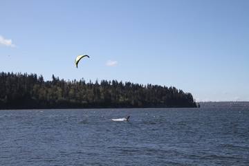 A wind surfer enjoying a sunny spring day