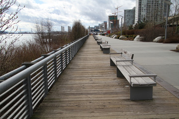 Fototapeta premium A row of benches on a pier