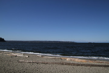 A view of container ships on the horizon