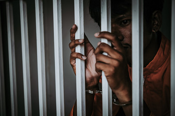 Hands of men desperate to catch the iron prison,prisoner concept,thailand people,Hope to be free.