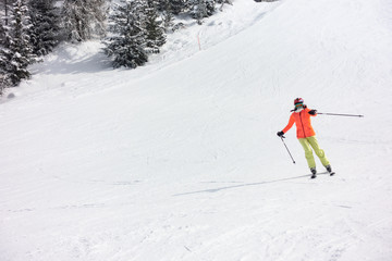 Young girl ski on groomed slope