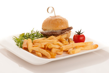 Gamburger with frenchfries on a plate isolated over white background