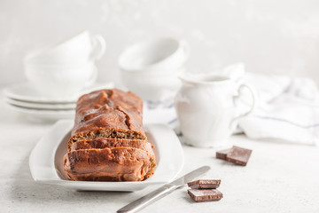 Homemade chocolate bread (cake) on a white background.