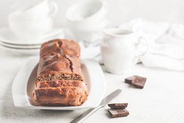 Homemade chocolate bread (cake) on a white background.