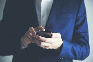 Hands of businessman calling by phon