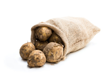 New potatoes  in sackcloth bag isolated on white