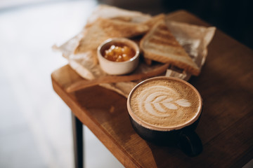 Cappuccino and toast with jam