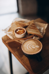 Cappuccino and toast with jam