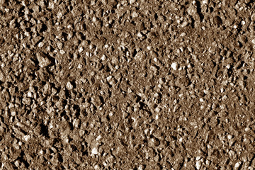 Pile of small gravel stones in brown tone.