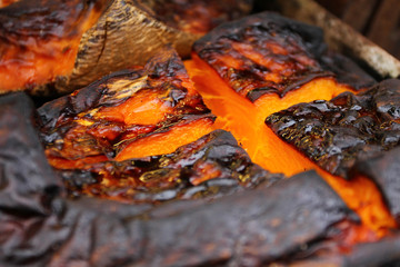Organic Pumpkin slice baked for Halloween holiday. Colorful baked squash background. Pumpkin texture pattern. Sweet Grilled pumpkin with honey for healthy food. Candy and dish for Thanksgiving day.