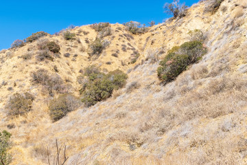 Fototapeta na wymiar Tough climb in California hiking area with blue sky for text
