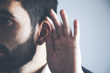 Fototapeta premium young man hand on the ear