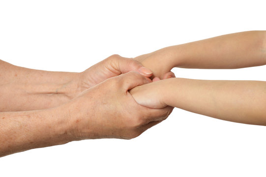 Adult hands holding kid hands on white background
