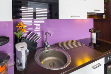Modern white and purple kitchen interior