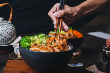 Japanese food, fried pork on rice, topped with sauce, Japanese style