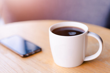 Hot espresso coffee in white cup, coffee shop