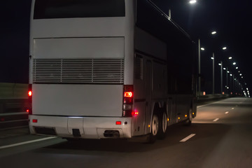 Bus Moves Over Night Highway