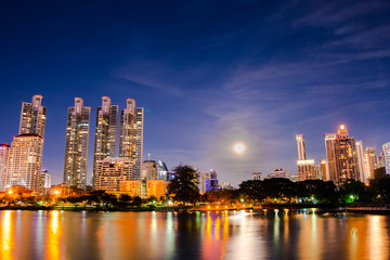 cityscape at night and a reflection of the river at Bangkok, Thailand