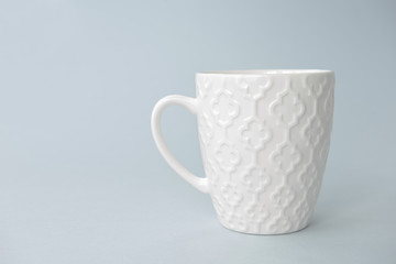 White tea mug on blue gradient background